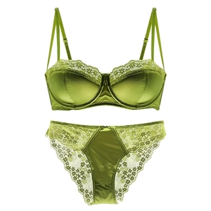 Grass green satin lingerie set with daisy lace trim and matching briefs on white background