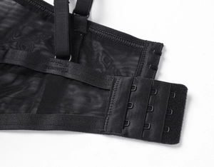Detail of adjustable straps and triple hook-and-eye closure on lace mesh lingerie