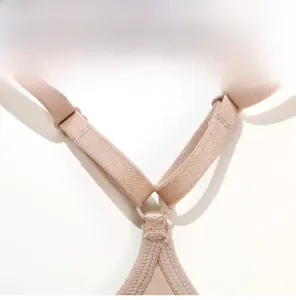 Detail of nude wireless bra showing the Y-shaped back straps and elastic texture