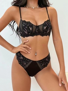 Detailed view of sheer floral lace lingerie set with high-waisted briefs in black
