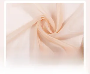 Macro detail of breathable light pink mesh fabric showing soft texture and fine weaving