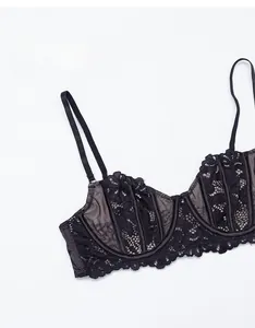 Close-up of thin lace bra featuring delicate embroidery and supportive underwire detail