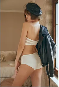Detailed back view of white strapless mesh bra and seamless panties set on a model