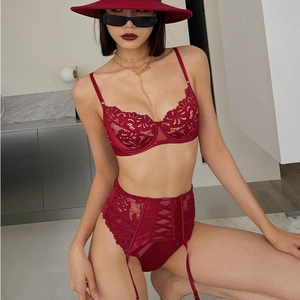 Three-piece red lace lingerie set with corset bra and high-waist garter belt