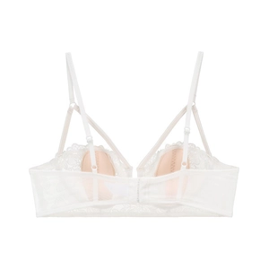 Detail of delicate French lace pattern and adjustable straps on this white balconette bra
