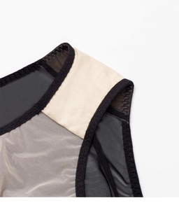 Detail shot of sheer mesh embroidery with black trim on French lace bra set lingerie