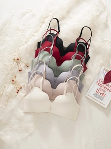 Detail shot of seamless wireless bras in six soft colors with elegant lace and pearls