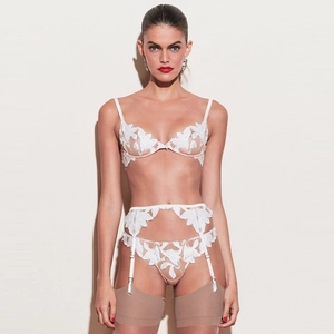Three-piece white lace lingerie set featuring delicate leaf embroidery and sheer mesh detail