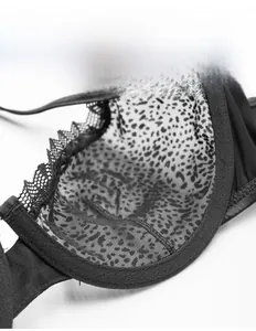 Macro detail of ultra-thin single-layer cup with leopard mesh and lace trim