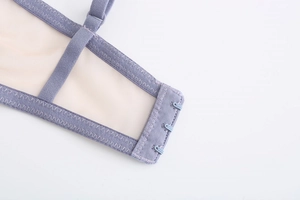 Detail of lavender lace bra showing three-row hook closure and breathable mesh wings