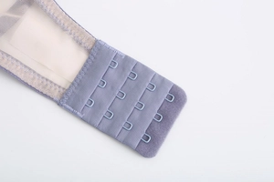 Detail of four-row hook and eye closure on lavender lace bra with breathable mesh fabric