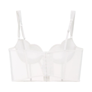 Dettaglio di un bustier in mesh bianco con bordi smerlati e stecche da corsetto