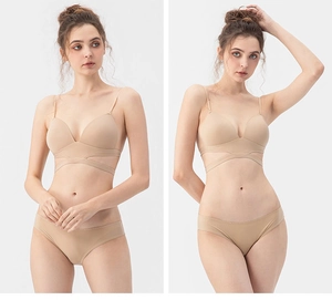 Detail of seamless beige backless lingerie set with decorative criss-cross strap design