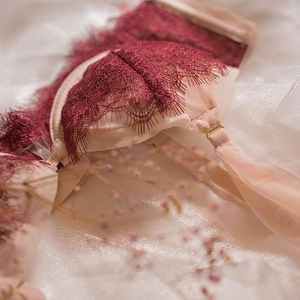 Lace bra set in wine red with eyelash details and adjustable gold buckle straps