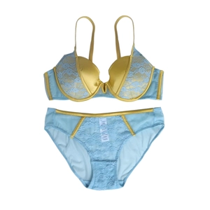Detail of blue lace and yellow satin lingerie set featuring soft underwired bra and briefs
