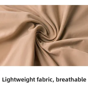 Close-up of khaki lightweight breathable fabric with fine texture and soft stretch