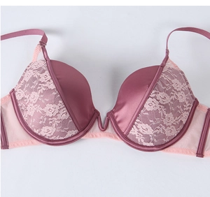 Detailed view of dusty pink lace and satin bra with underwire and floral embroidery pattern
