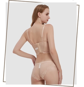Detailed back view of a beige lace corset bra with adjustable straps and hook-and-eye closure