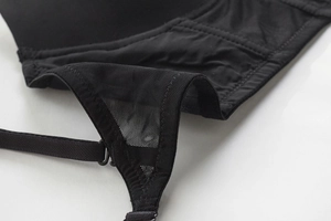 Detail of black seamless bra with breathable mesh fabric and elastic stitching