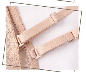 Detailed close-up of adjustable lace bra strap with mesh texture and matching slider