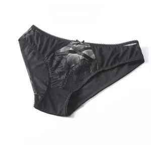 Detailed view of black eyelash lace panties with floral embroidery and bow