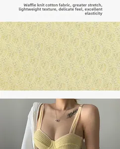 Detailed macro view of yellow waffle knit cotton fabric texture for women's bra top