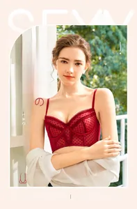 Detail of red polka dot lace bra with soft underwire support and elegant floral trim
