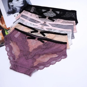 Detail of assorted lace mesh panties featuring heart metal buckles and cut-out waist design