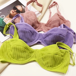 Detailed waffle texture of breathable non-wired bras in pink, purple and green colors