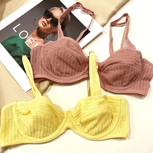 Detailed macro view of waffle texture fabric on breathable soft-cup bras for women