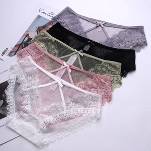 Flat lay of lace panties in various colors with bow details and hollow-out mesh design