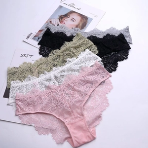 Flat lay of lace panties in pink, white, green and black with floral embroidery details