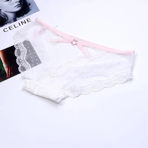 Detail of white lace panties with pink waistband and heart-shaped metal buckle detail