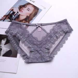 Detailed view of light purple lace panties with floral embroidery and bow detail