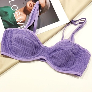 Close-up of purple waffle texture fabric with underwire support and adjustable strap