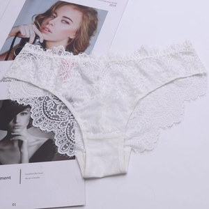 Close-up of white floral lace underwear with eyelash trim and cotton crotch detail