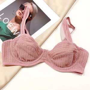 Detailed close-up of pink jacquard mesh lace bra with elegant honeycomb texture and dual straps