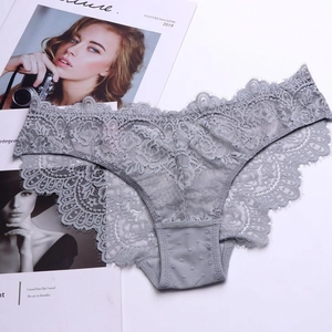 Close-up of gray floral lace underwear with scalloped edges on a white background
