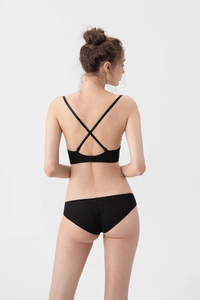 Detail view of black seamless lingerie set featuring a deep V cross-back strap design
