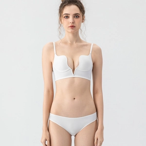 Detail view of smooth white deep V-neck push-up bra and matching panties set