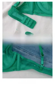 Detail view of lime green mesh bra featuring double row hooks and wide side wings
