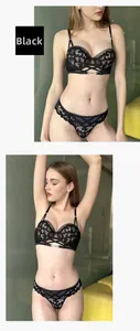 Detailed view of a black lace lingerie set with halter bra and matching cutout panties