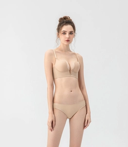 Seamless deep V bra and matching panties set in nude skin tone with elastic fabric