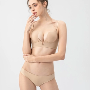 Detail view of seamless deep V neck push-up bra set in beige on a professional model