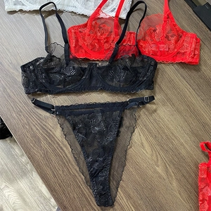 Detail of sheer lace embroidery on underwire bra and matching thong set