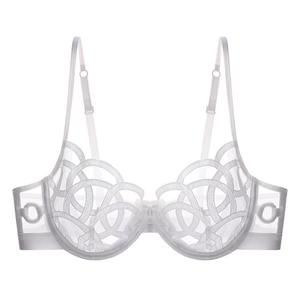 Detail of white sheer mesh lace bra with intricate embroidery and underwire support