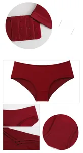Detail view of seamless red panties featuring wide waistbands and three-row hook closures