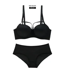 Flat lay of seamless black lingerie set with contoured push-up bra and matching panties