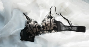Close-up of black floral embroidery and mesh detail on this sexy lace bra with back closure