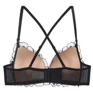 Lace bralette with sexy X-back straps and delicate black mesh detailing on skin-tone cups